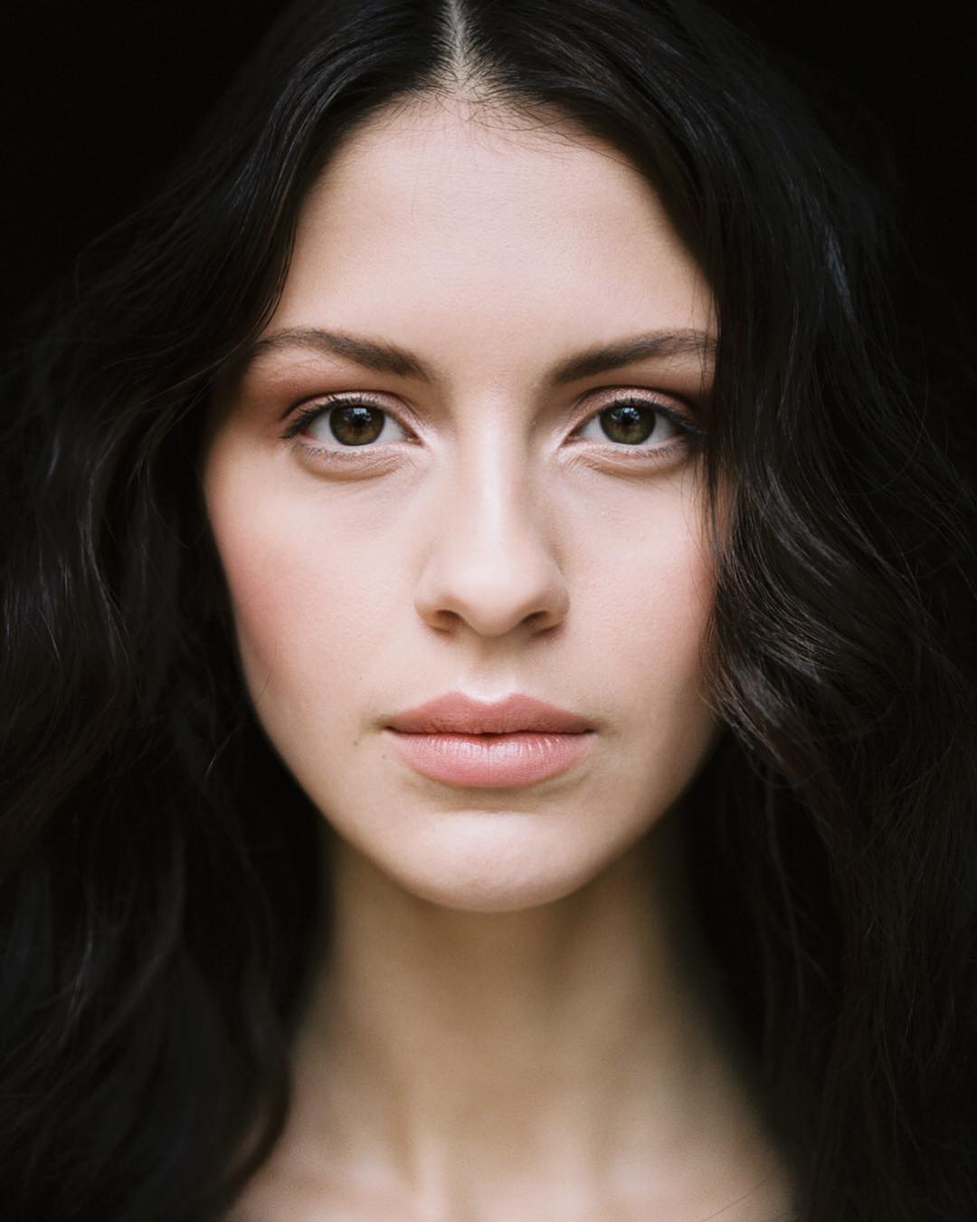 Closeup image of bride with dark hair. Captured by Portland Wedding Photographer Carlos Hernandez